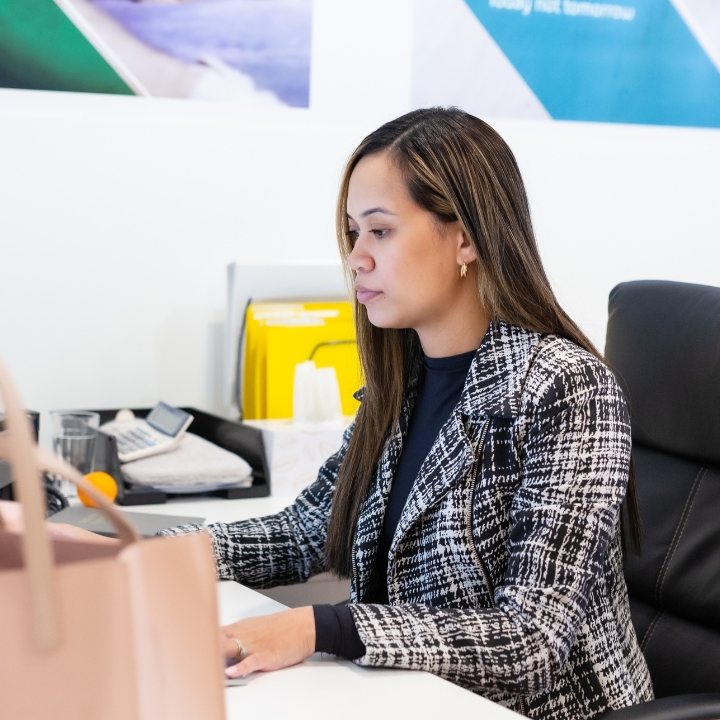 Adele at the computer part of our Mortgage Broker Brunswick team